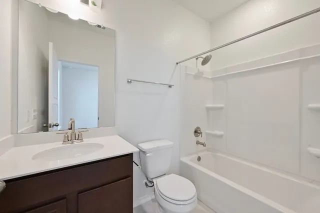 a bathroom with a sink a toilet and a bathtub