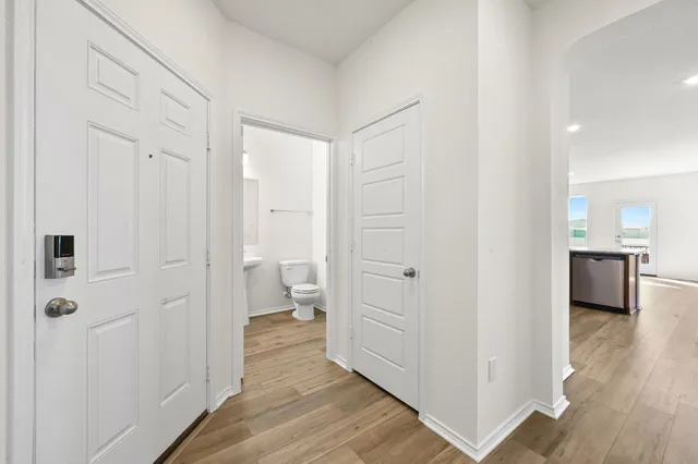 a view of a bathroom from the hallway