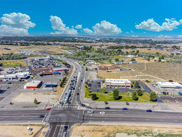 a view of multiple houses with outdoor space