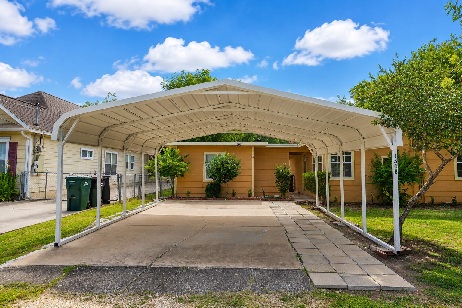 1508 Walnut Street Georgetown, TX 78626 - Photo 15 of 37 A well-maintained carport offers convenient parking at this charming residence.