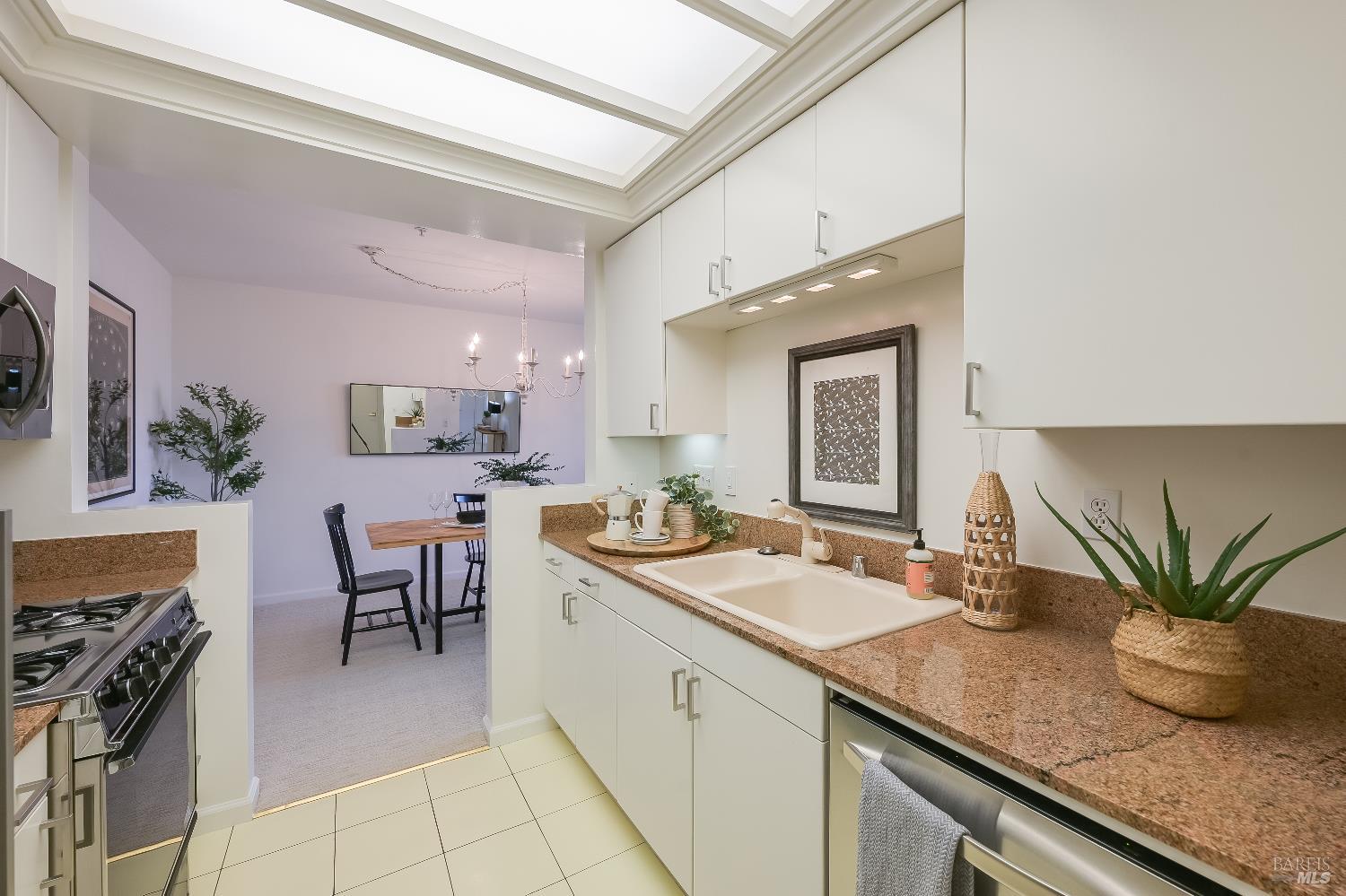 400 Deer Valley Road, Unit 2A San Rafael, CA 94903 - Photo 5 of 22 a kitchen with sink and stove