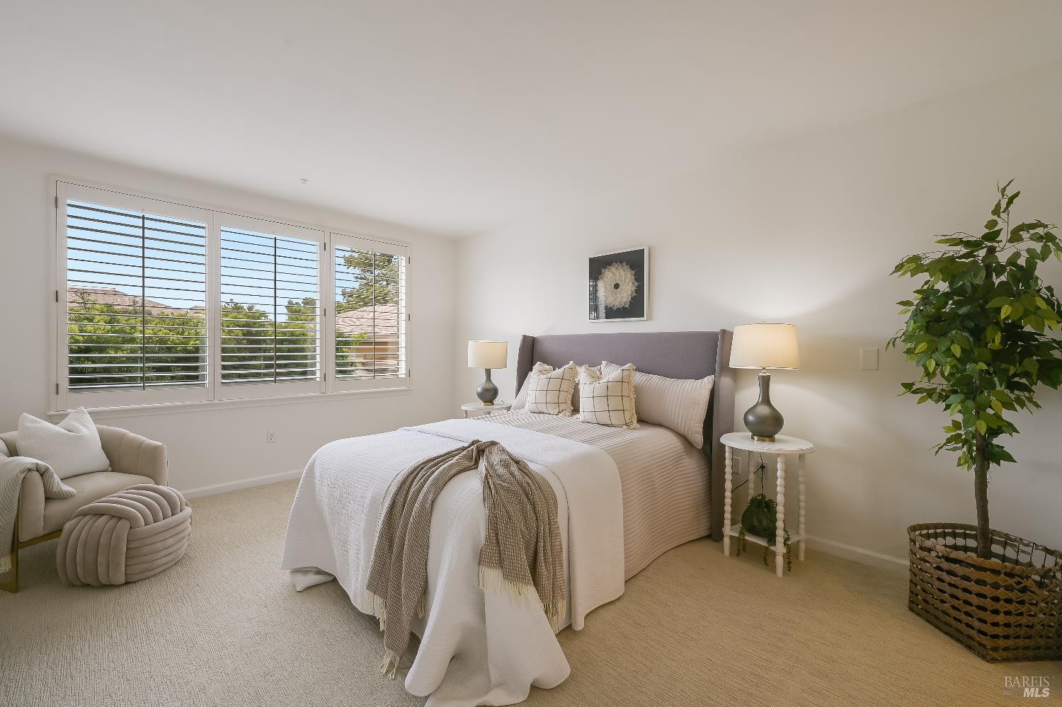 400 Deer Valley Road, Unit 2A San Rafael, CA 94903 - Photo 8 of 22 a spacious bedroom with a bed and a potted plant