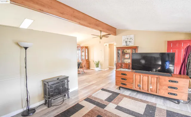 a living room with furniture and a rug