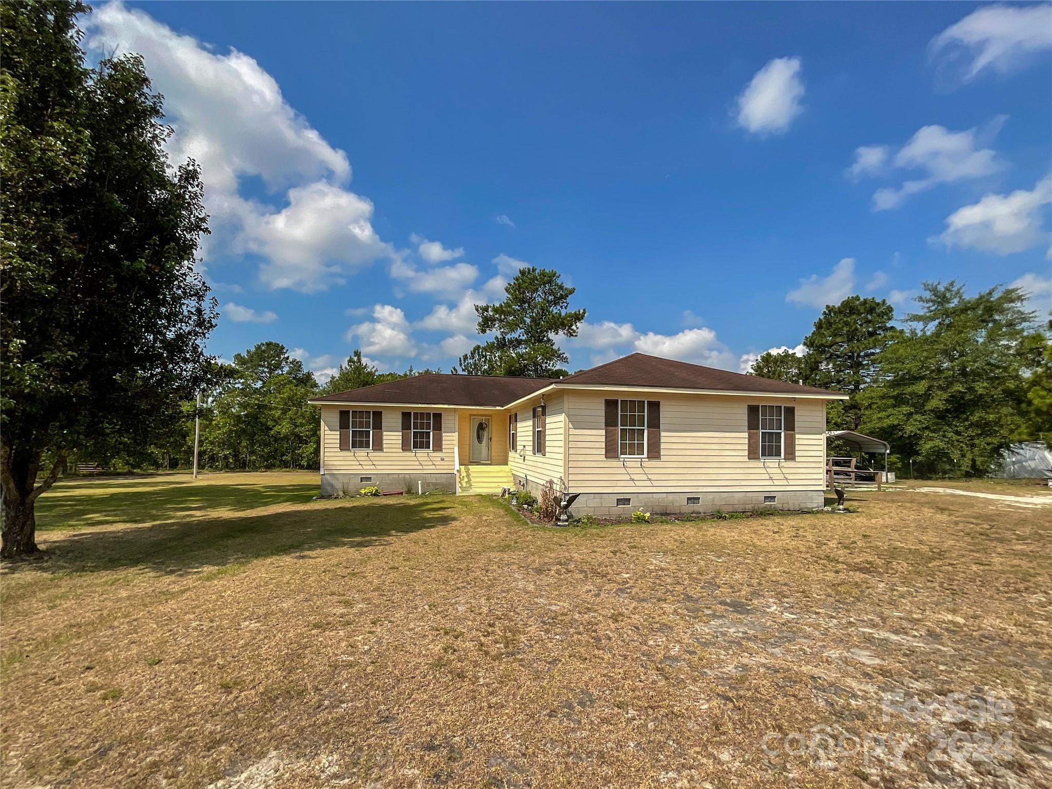 267 Homeplace Road Rockingham, NC 28379 - Photo 36 of 47 a front view of a house with a yard