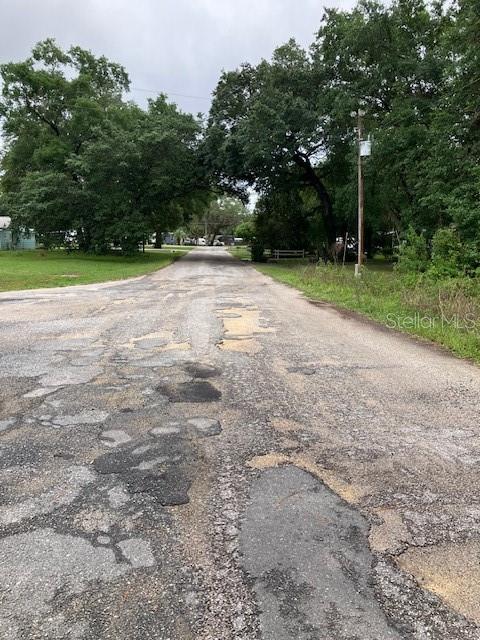 Southeast 21st Place Road Silver Springs, FL 34488 - Photo 5 of 5 a view of a field with trees in background