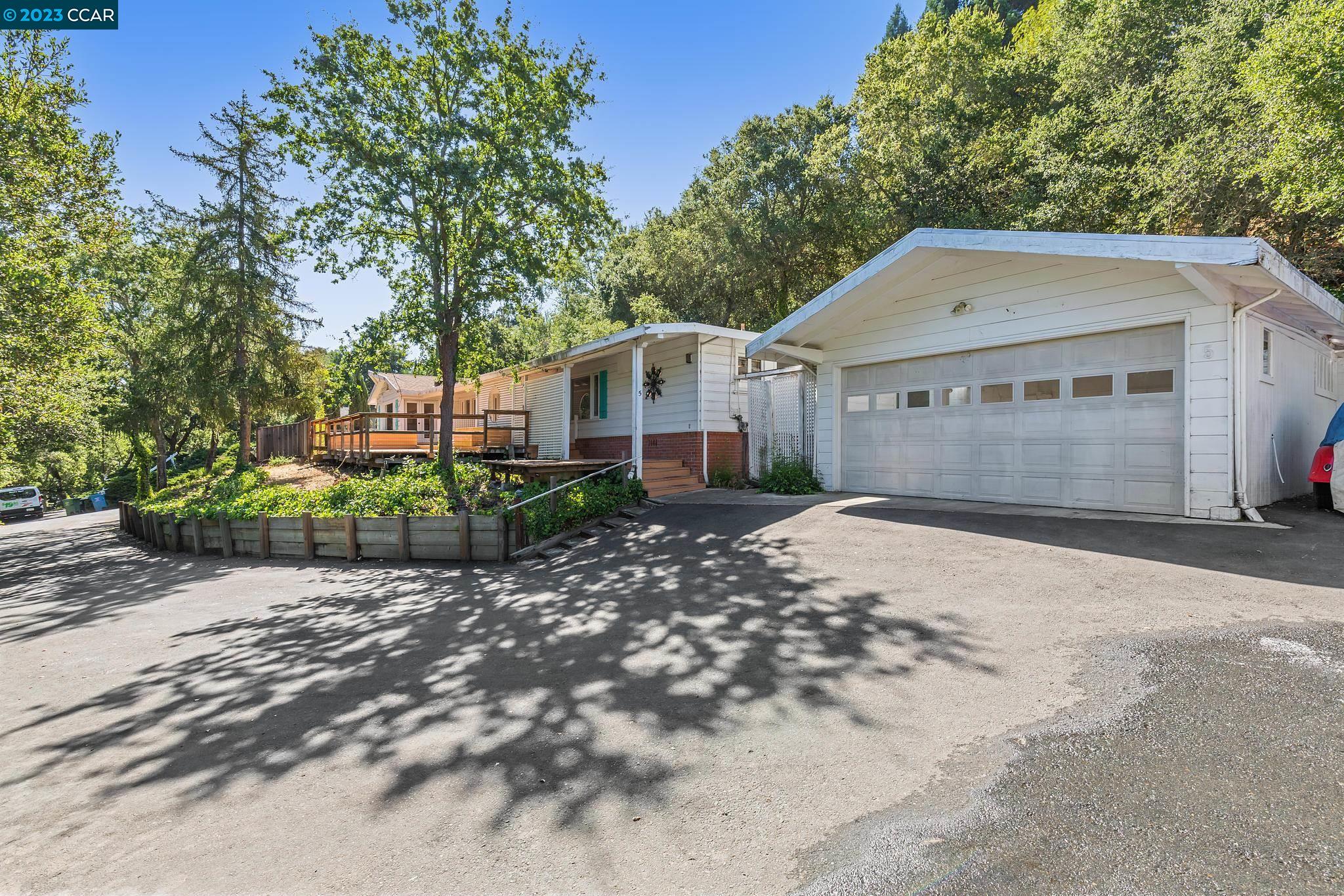 a view of a small yard in front of a house