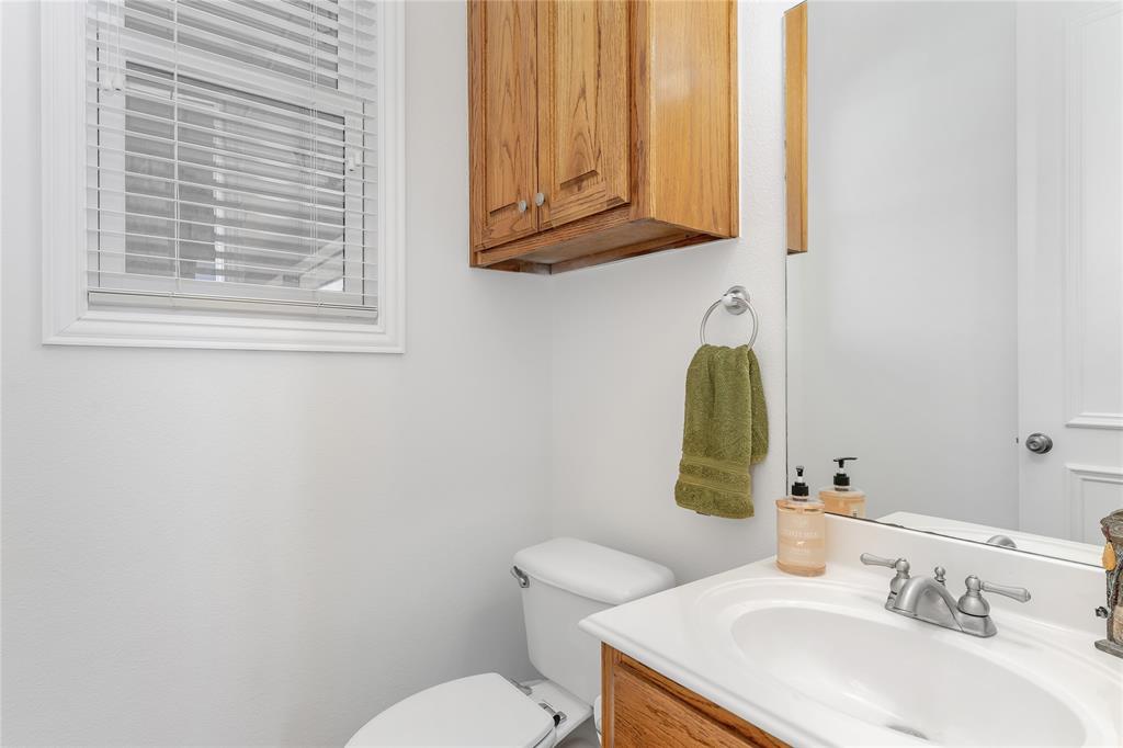 4520 South Nolan River Road Cleburne, TX 76033 - Photo 25 of 40 Half bath with toilet and vanity