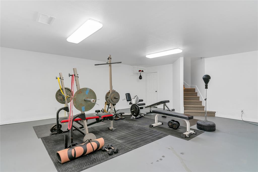 4520 South Nolan River Road Cleburne, TX 76033 - Photo 27 of 40 Exercise room featuring visible vents and baseboards