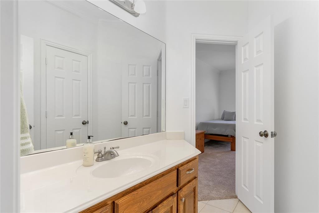 4520 South Nolan River Road Cleburne, TX 76033 - Photo 35 of 40 Bathroom featuring tile patterned floors and vanity