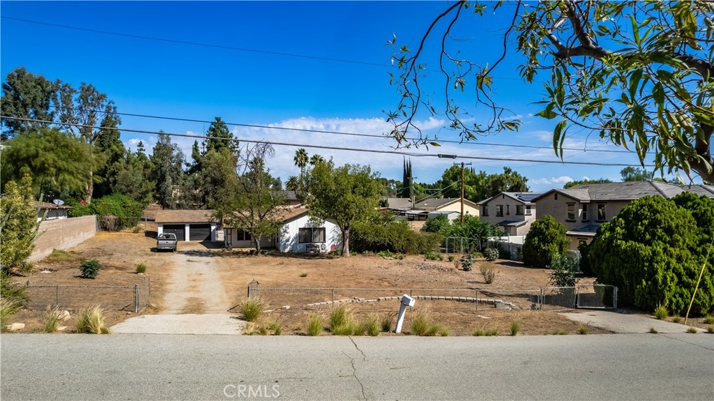 12043 Knoefler Drive Riverside, CA 92505 - Photo 15 of 15 a view of a house with potted plants and large trees