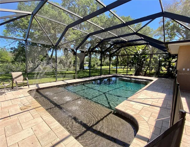 a view of a swimming pool with a patio
