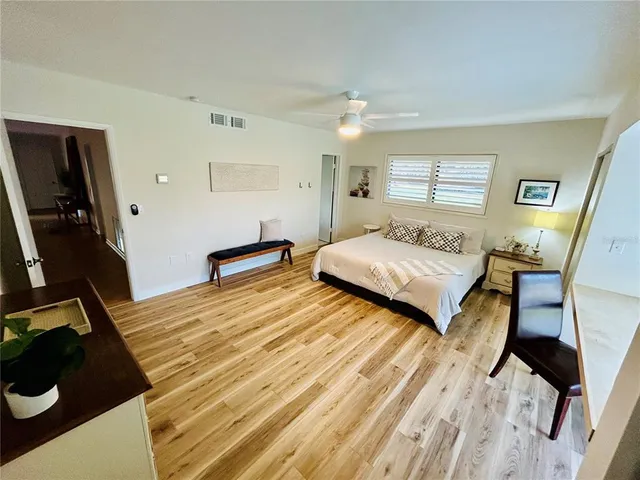 a bedroom with a bed and a dresser