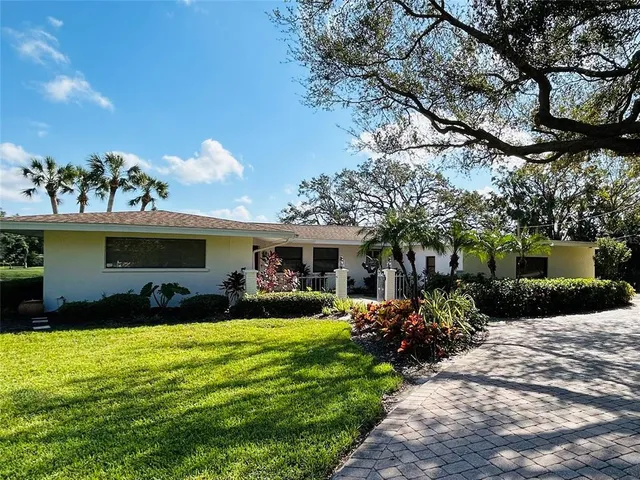 a front view of house with yard outdoor seating and green space