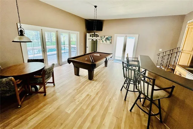 a living room with furniture a rug and a chandelier