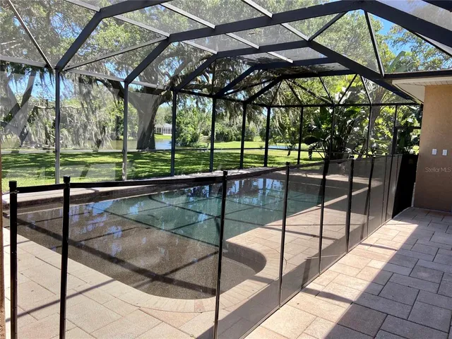 a view of a swimming pool with a patio