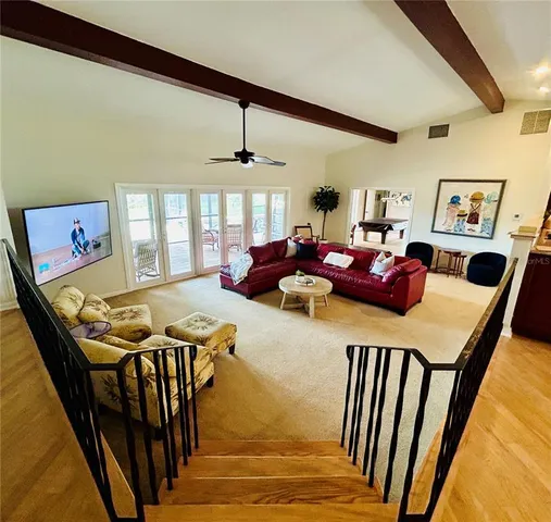 a bedroom with furniture and a window