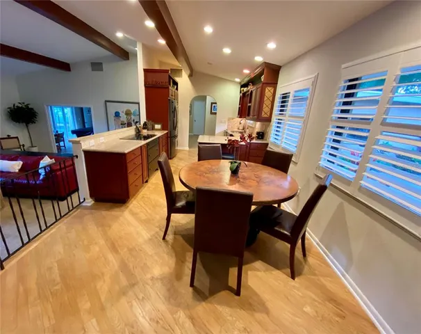 a dining room with furniture and a rug