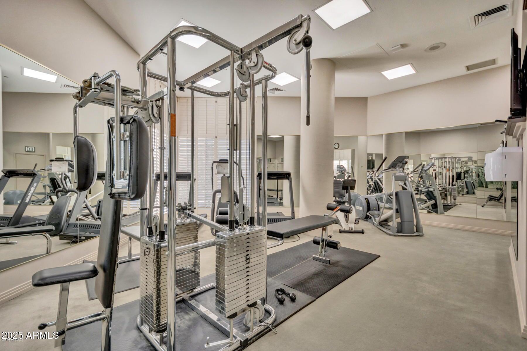 1040 East Osborn Road, Unit 1103 Phoenix, AZ 85014 - Photo 39 of 49 a view of a room with gym equipment