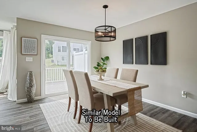 a view of a dining room with furniture wooden floor and chandelier