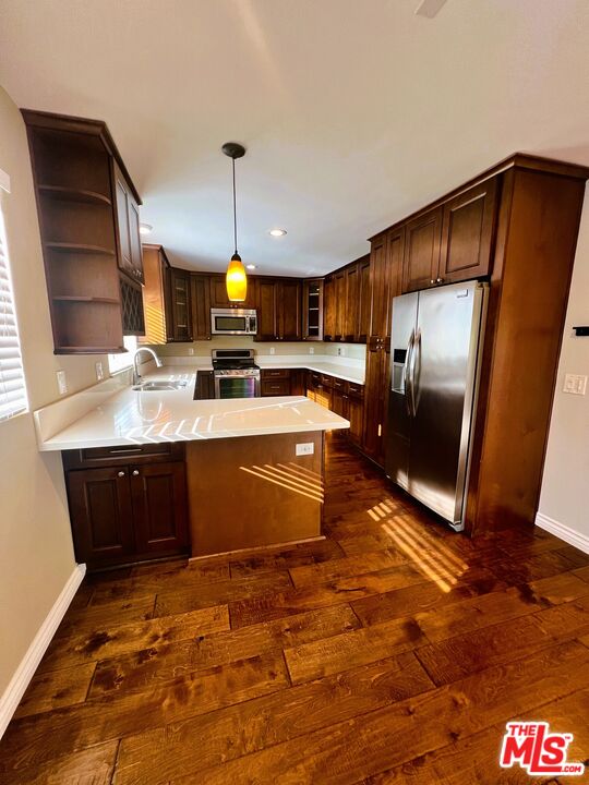 1122 10th Street, Unit 4 Santa Monica, CA 90403 - Photo 8 of 18 a kitchen with stainless steel appliances granite countertop a stove a sink dishwasher and a refrigerator