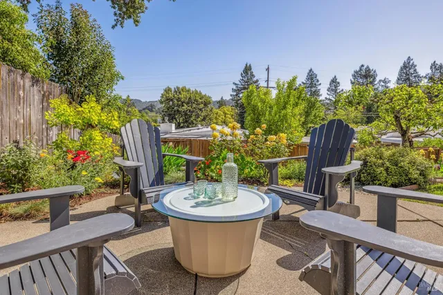 a picture of flowers with wooden fence