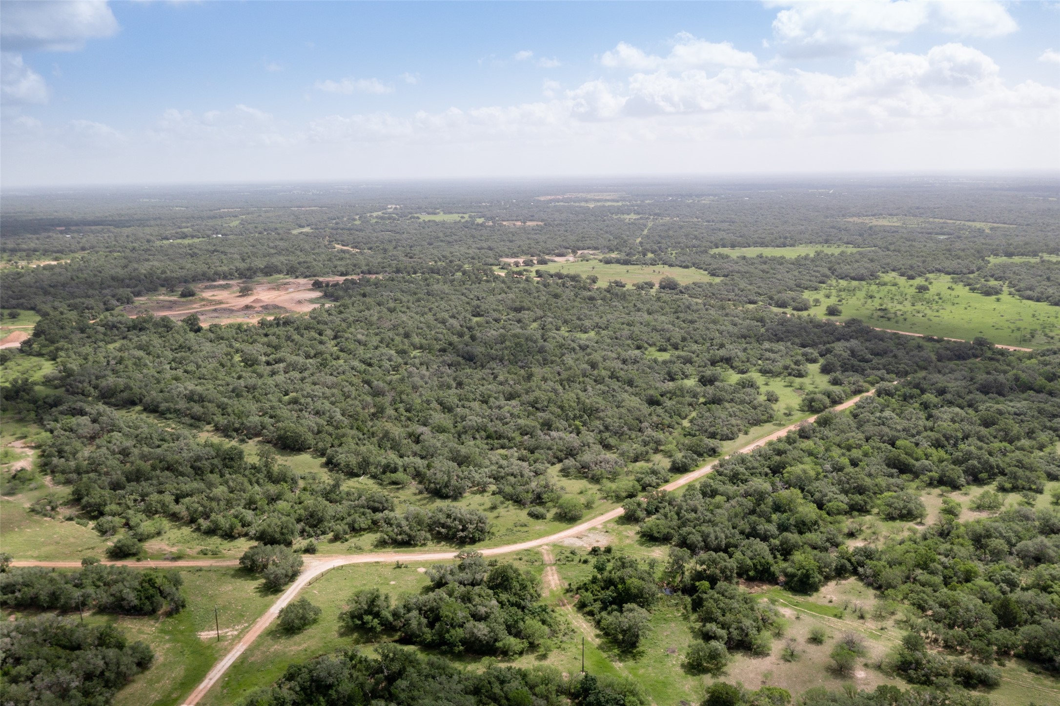 54.68-acres Cattle Guard Road Cuero, TX 77954 - Photo 20 of 50 an aerial view of multiple house