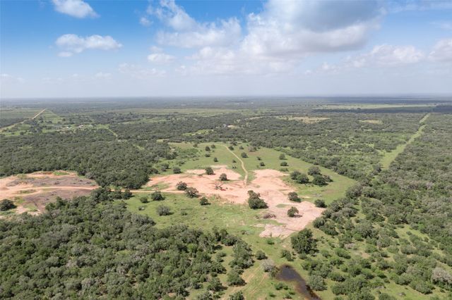 an aerial view of a houses with outdoor space