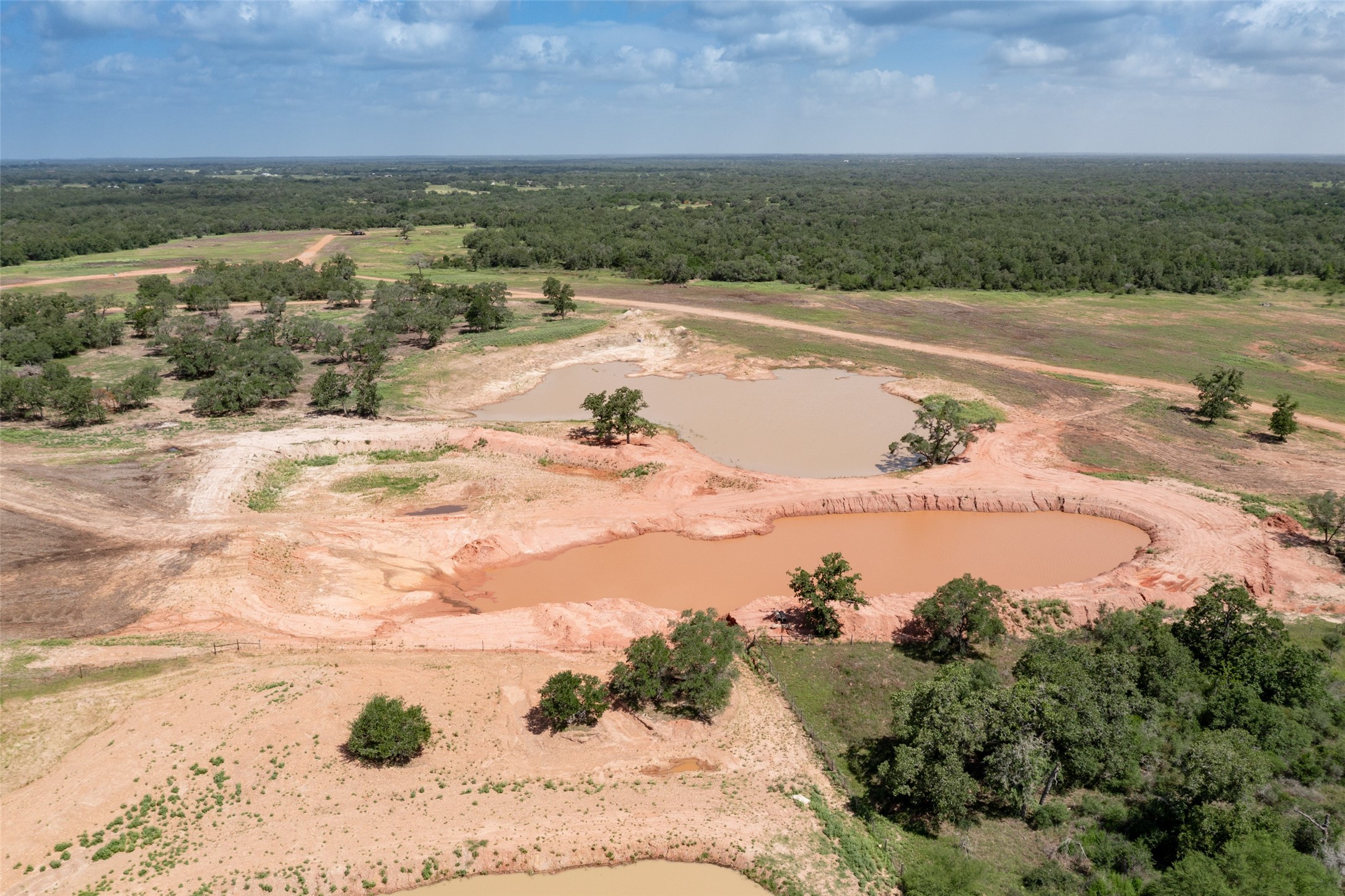 54.68-acres Cattle Guard Road Cuero, TX 77954 - Photo 40 of 50 a view of a lake and outdoor space