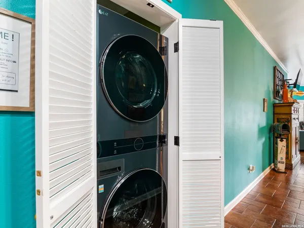 a close view of a utility room with washer and dryer