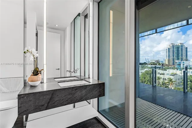 a view of a living room and a balcony