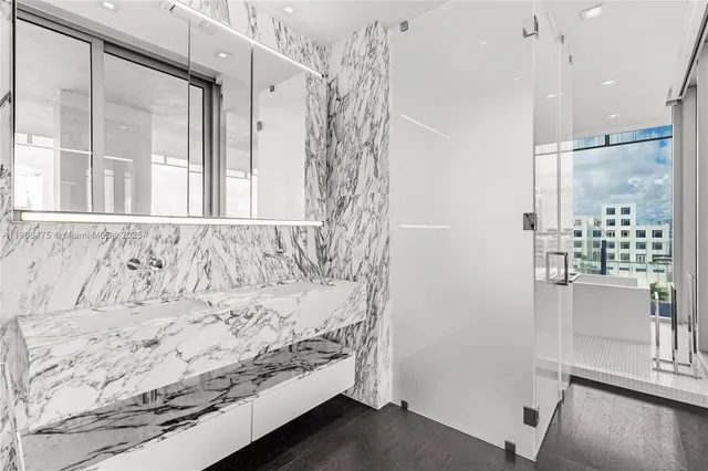 a bathroom with a bathtub and shower