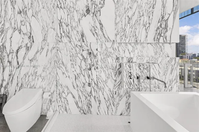 a bathroom with a bathtub and sink