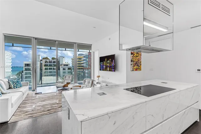 a kitchen with a sink and a counter top space
