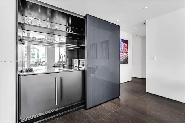 a kitchen with granite countertop cabinets and window
