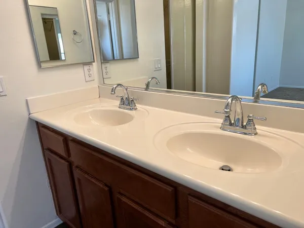a bathroom with a sink and a mirror
