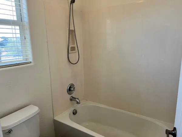 a bathroom with a bath tub and a shower