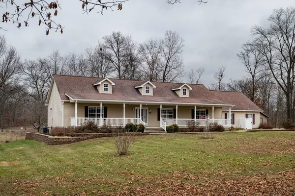 a house view with a backyard space