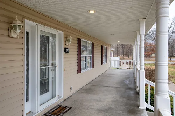 a view of deck with wooden floor and seating space