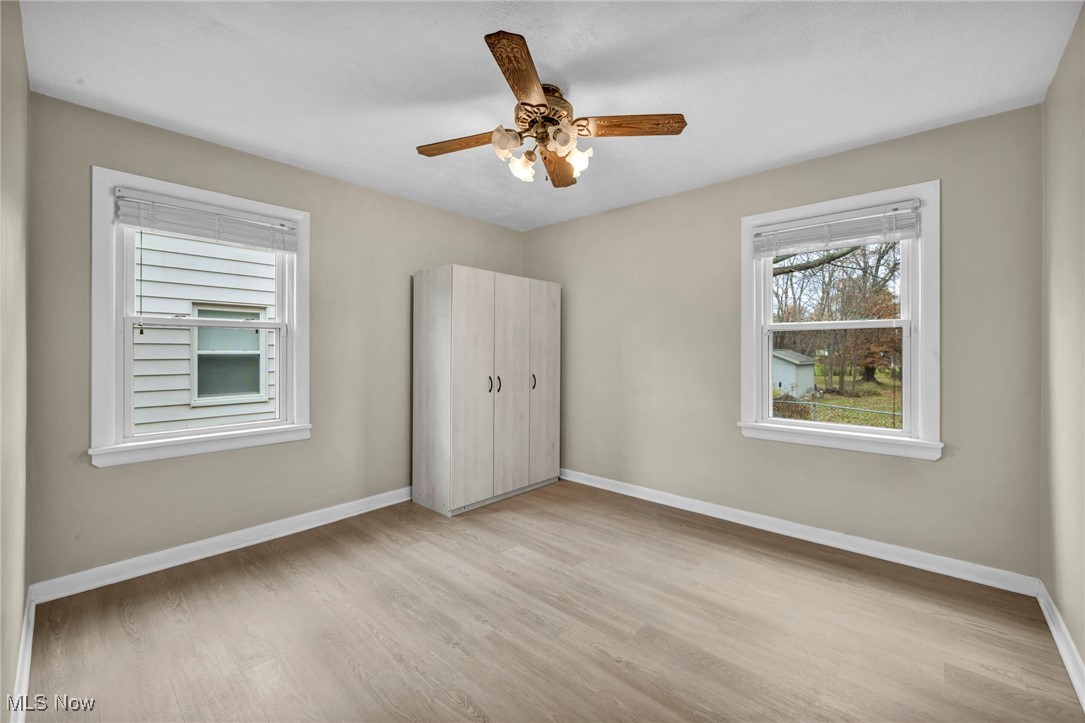 1682 Overbrook Road Lyndhurst, OH 44124 - Photo 18 of 33 Unfurnished bedroom featuring light wood finished floors and a ceiling fan