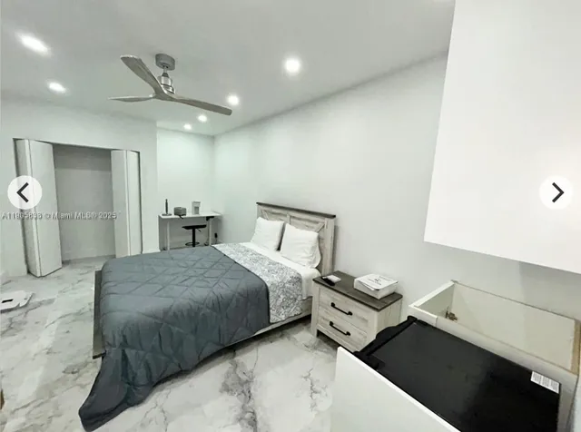 a bedroom with a bed and a walk in closet