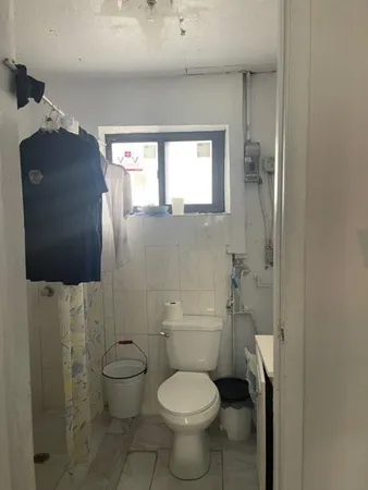 a bathroom with a toilet and a sink