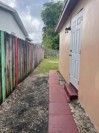a view of a pathway of a house with wooden floor