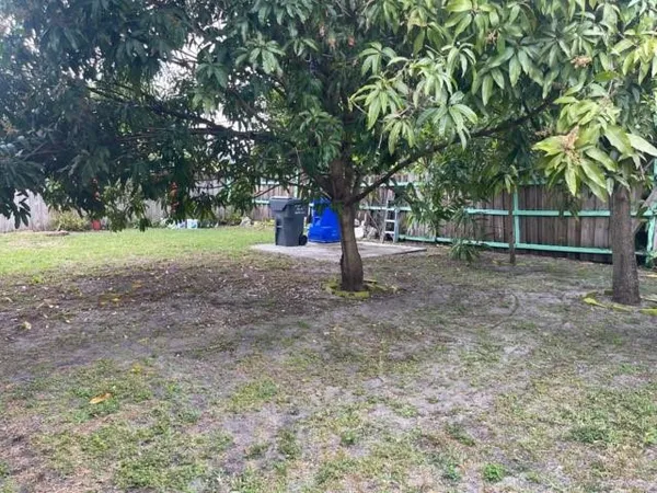 a backyard of a house with lots of green space