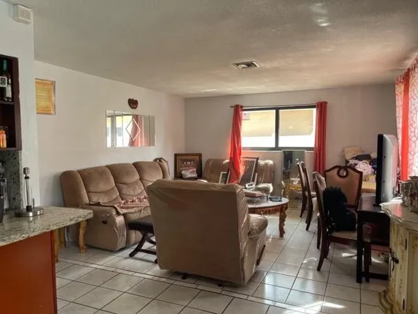 a living room with furniture and a window