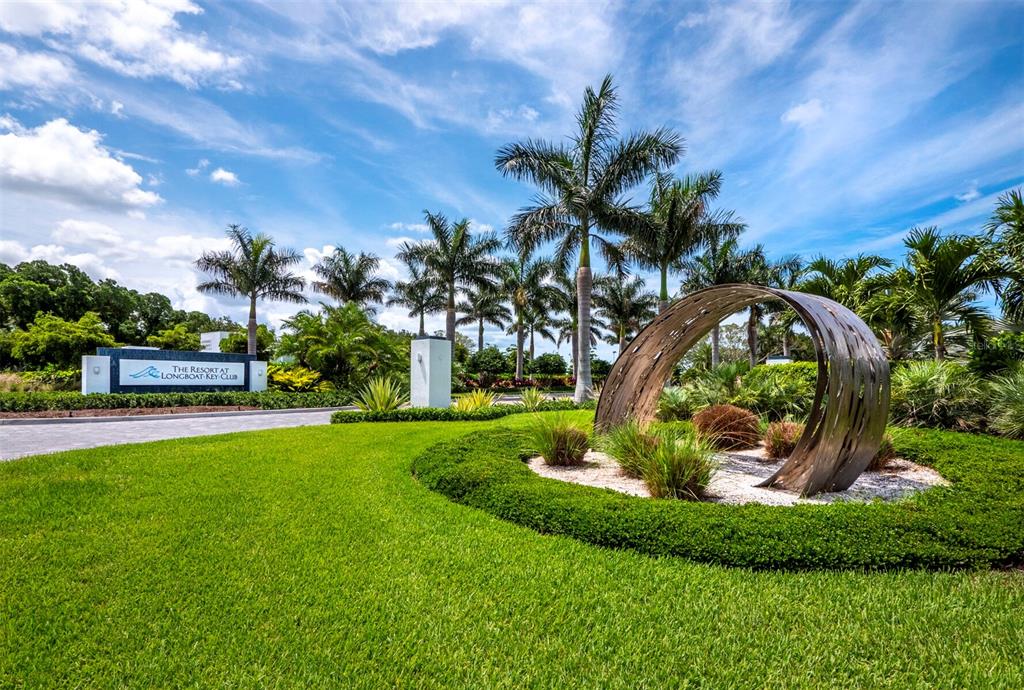 455 Longboat Club Road, Unit 402 Longboat Key, FL 34228 - Photo 44 of 48 a view of a garden with a fountain