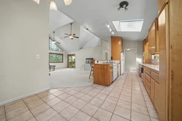 a kitchen with a sink cabinets and window