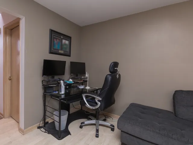 a view of a workspace with furniture