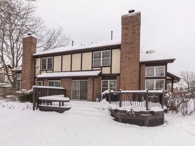 a car parked in front of a brick house