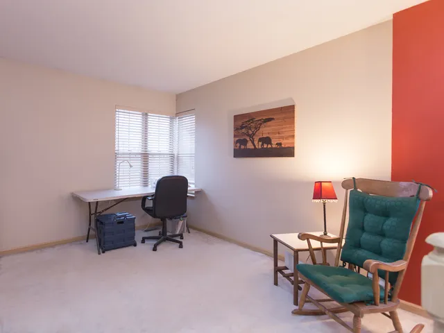 a work room with furniture and a window
