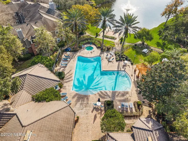 a aerial view of a building with swimming pool